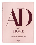 Book titled 'AD at Home' edited by Amy Astley on a pink background