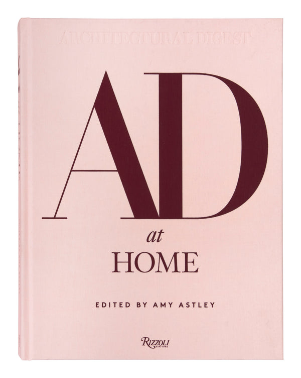 Book titled 'AD at Home' edited by Amy Astley on a pink background
