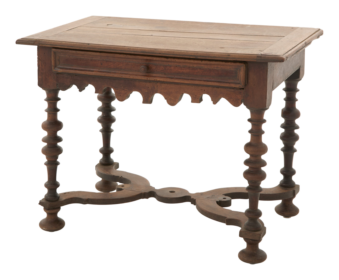 Wooden table with a single drawer and intricate legs on a white background