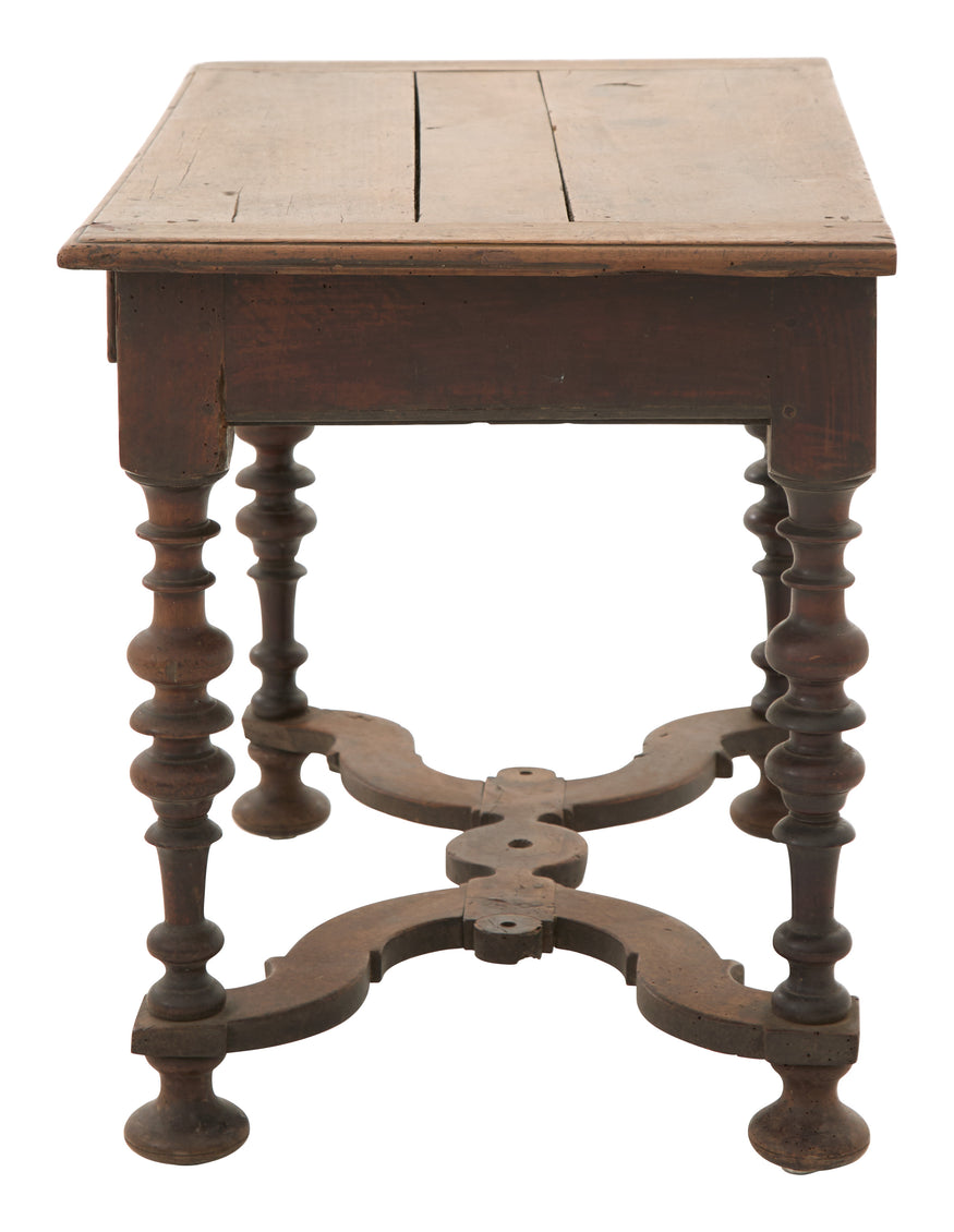 Wooden table with intricate legs on a white background