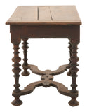 Wooden table with intricate legs on a white background