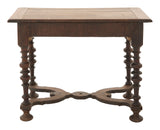 Wooden table with turned legs on a white background